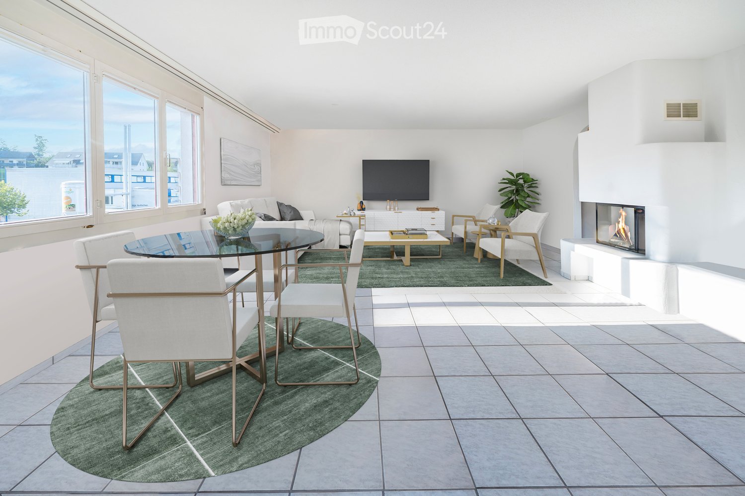Modern living room with large windows, white walls, grey sofa, coffee table, armchairs, ottoman, fireplace, glass dining table, and chairs.