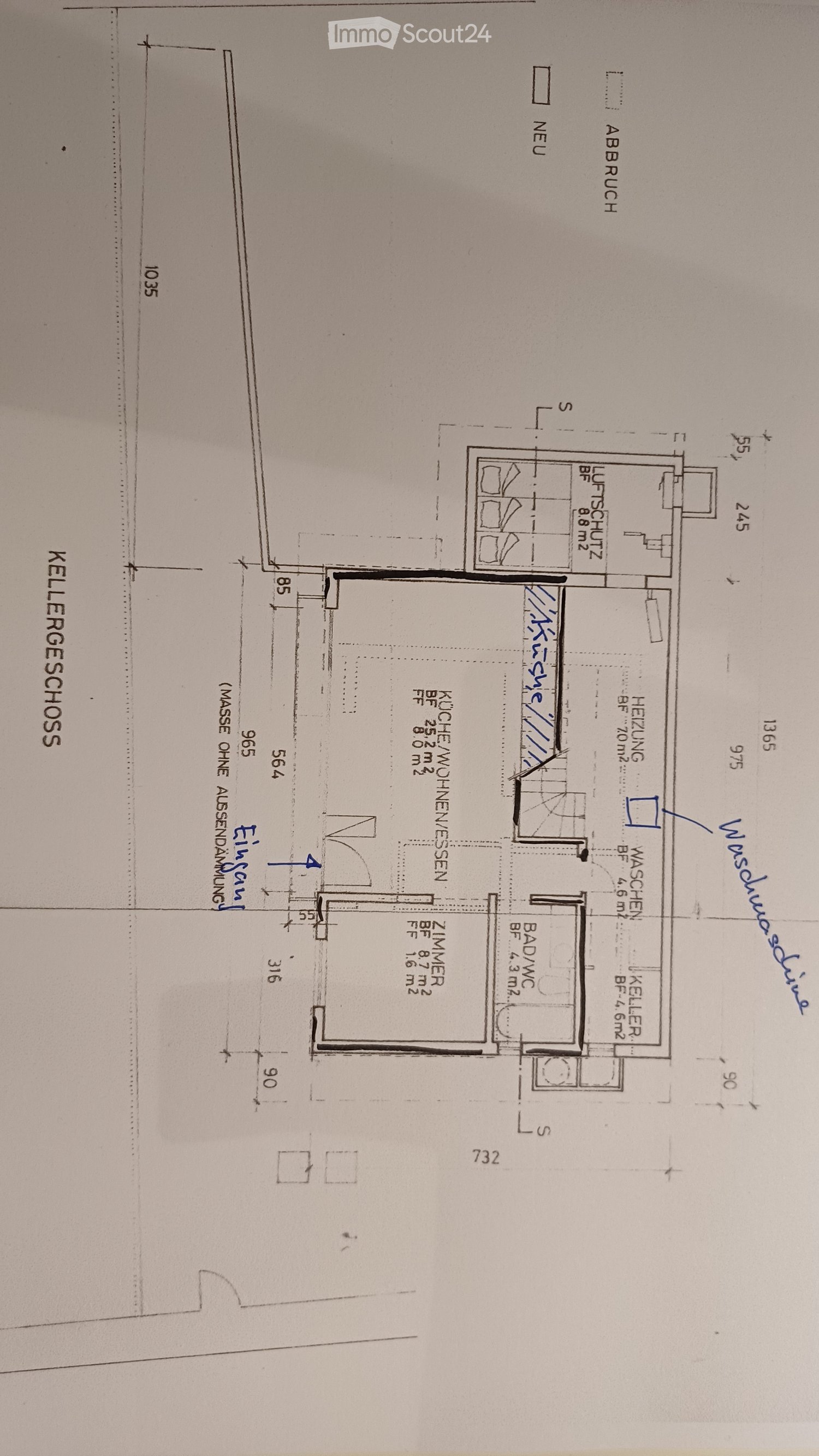 Floor plan of a basement level showing a kitchen, living room, bedroom, bathroom, and utility area.