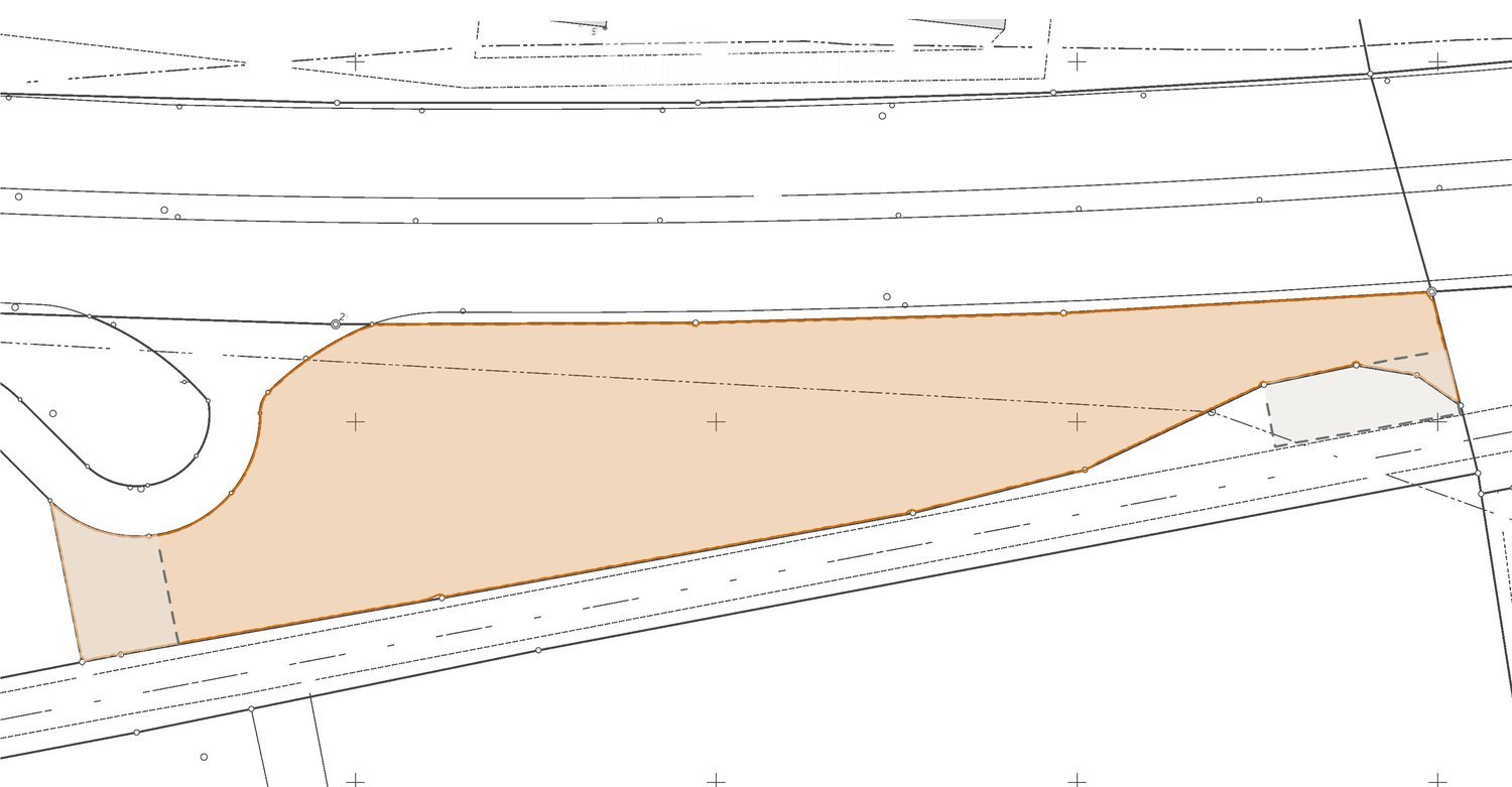 Floor plan showing a large rectangular area with a curved section on one side, likely a living space or open-plan area.