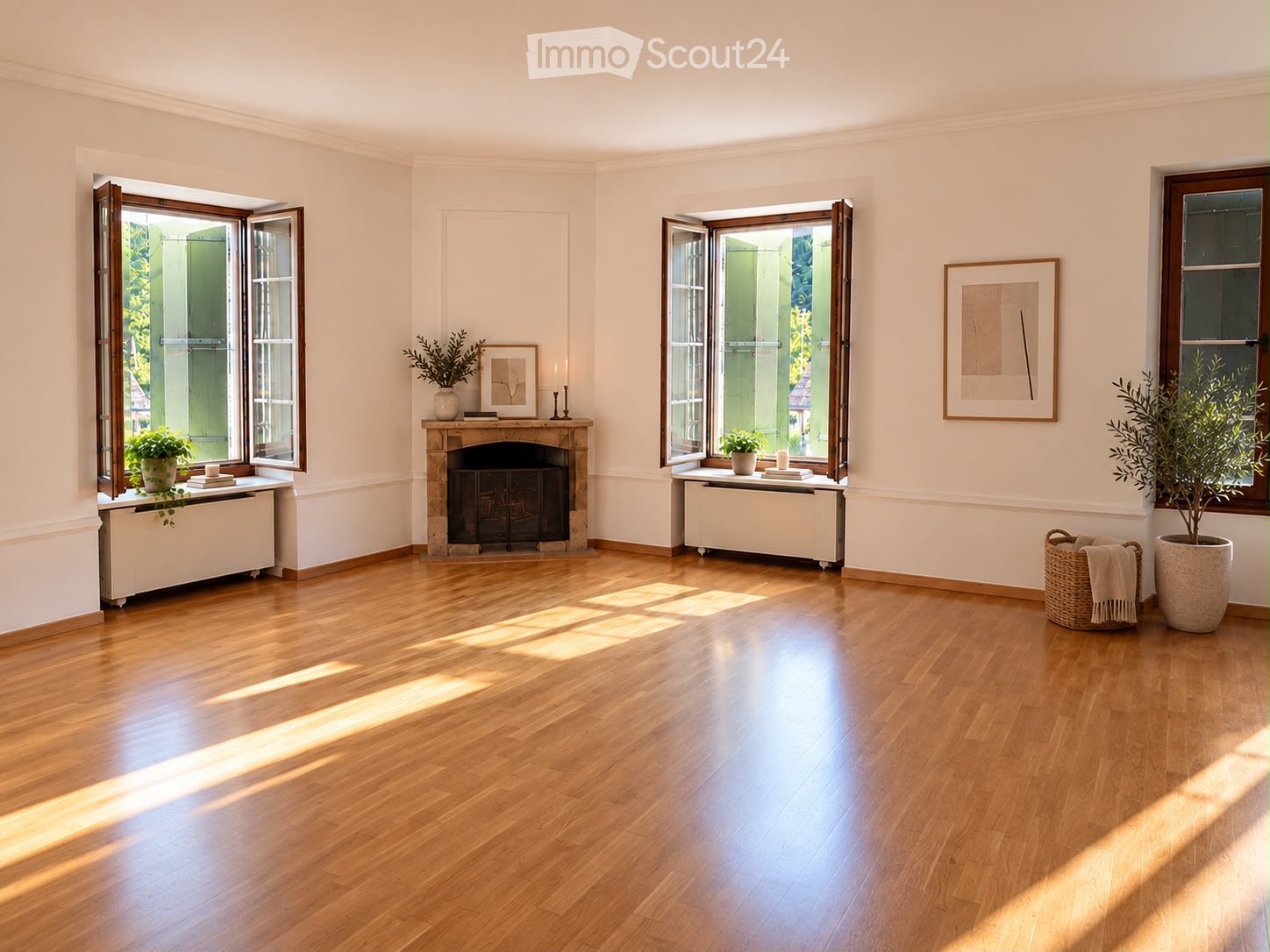 Bright living room with hardwood floors, fireplace, large windows, radiators, and decorative plants.