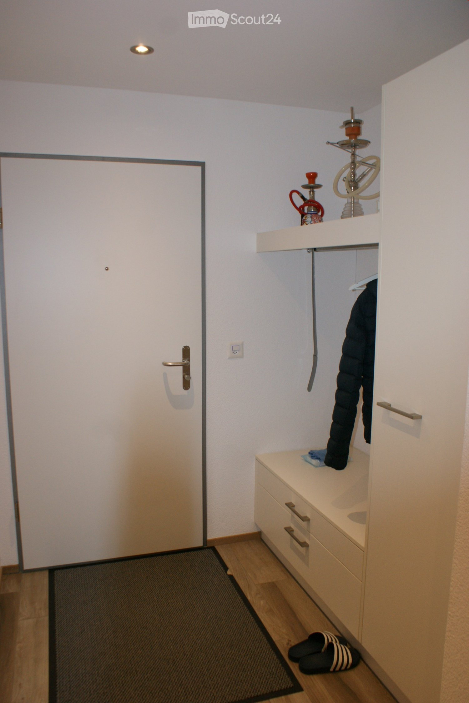{"type": "Furnished Room", "objects": ["drawer unit", "shelf", "hook", "hook", "hook", "hook", "hook", "hook", "hook", "hook", "hook", "hook", "hook", "hook", "hook", "hook", "hook", "hook", "hook", "hook", "hook", "hook", "hook", "hook", "hook", "hook",