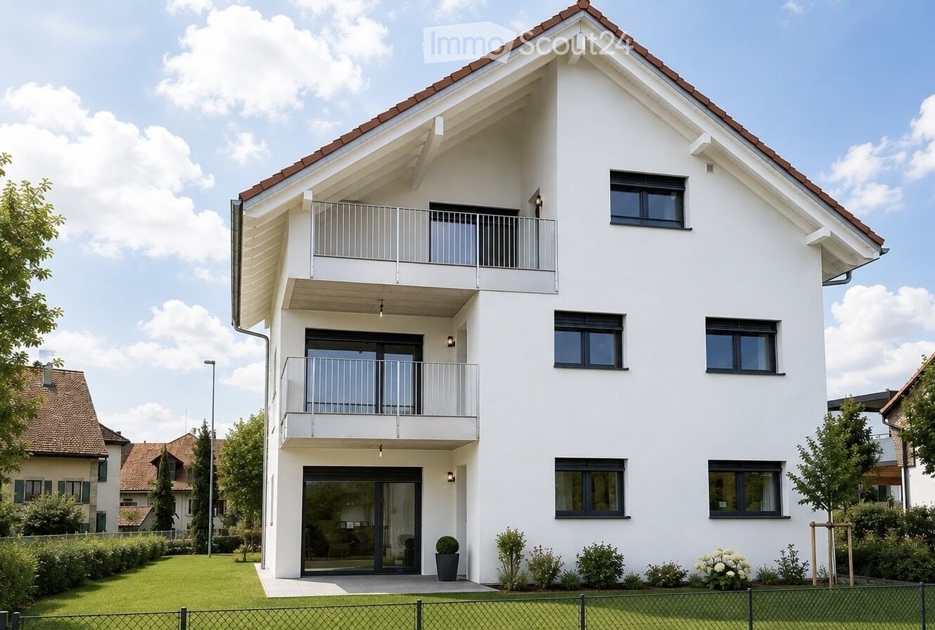 Modern two-story house with white exterior, multiple balconies, and a well-maintained lawn.