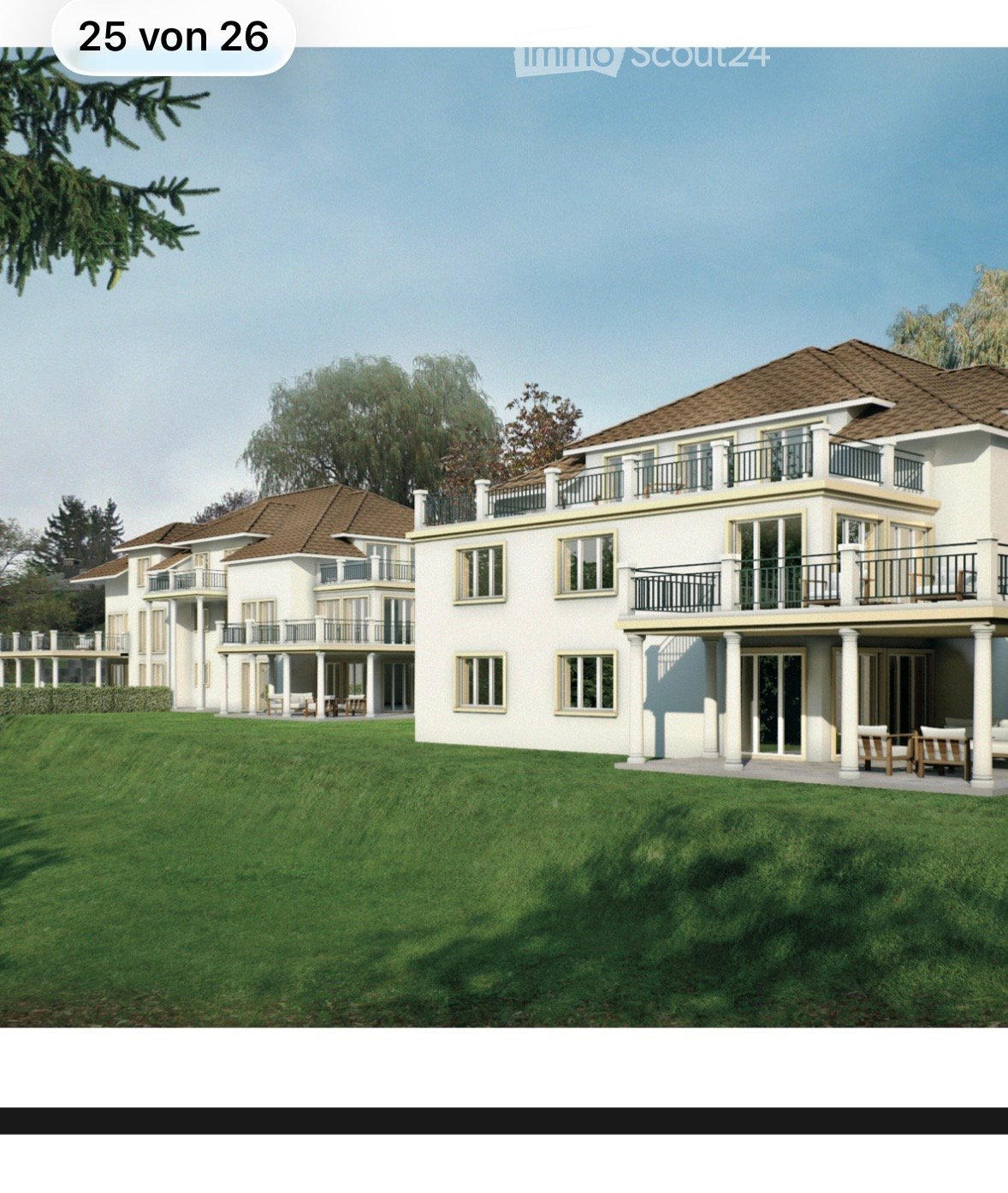 Large, modern two-story house with white exterior, multiple balconies, and a spacious lawn.