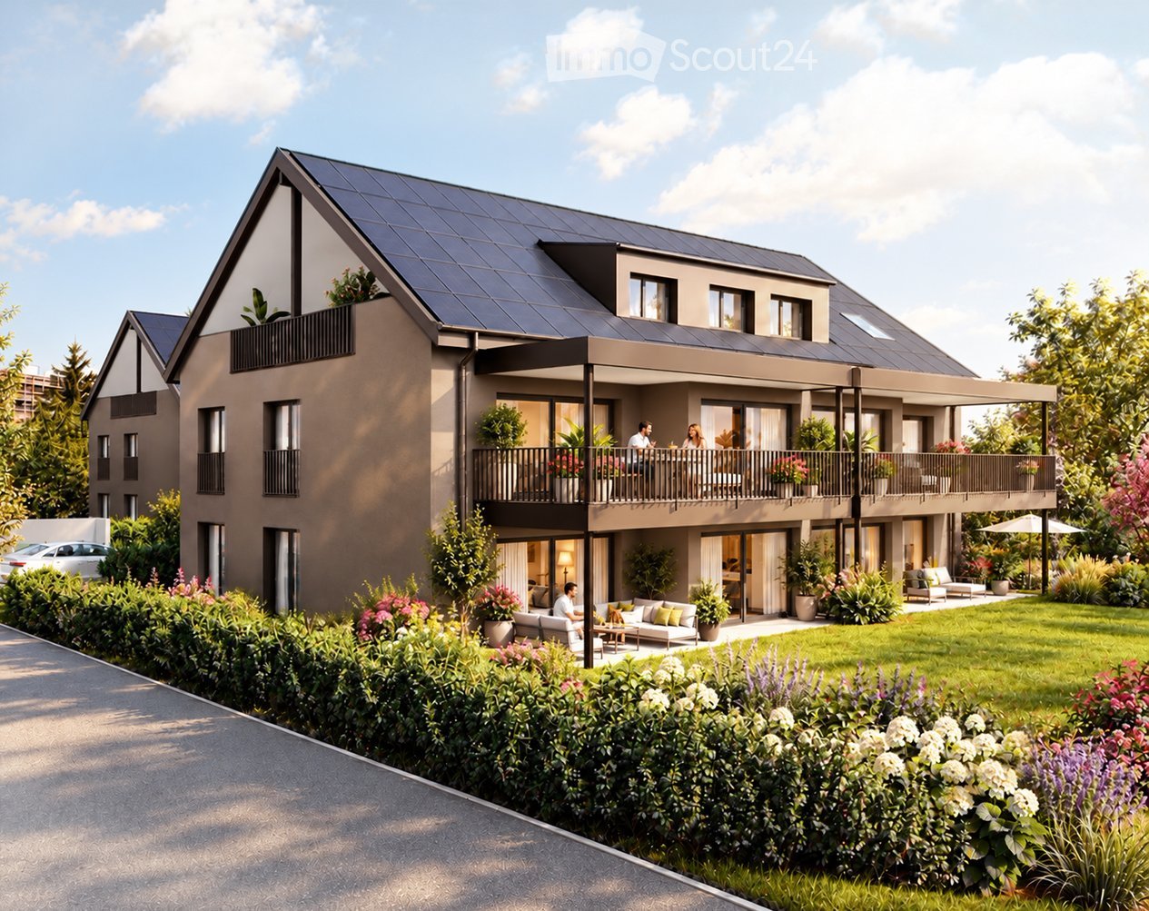Modern two-story house with solar panels on the roof, large windows, balconies, and a well-maintained garden with seating areas.