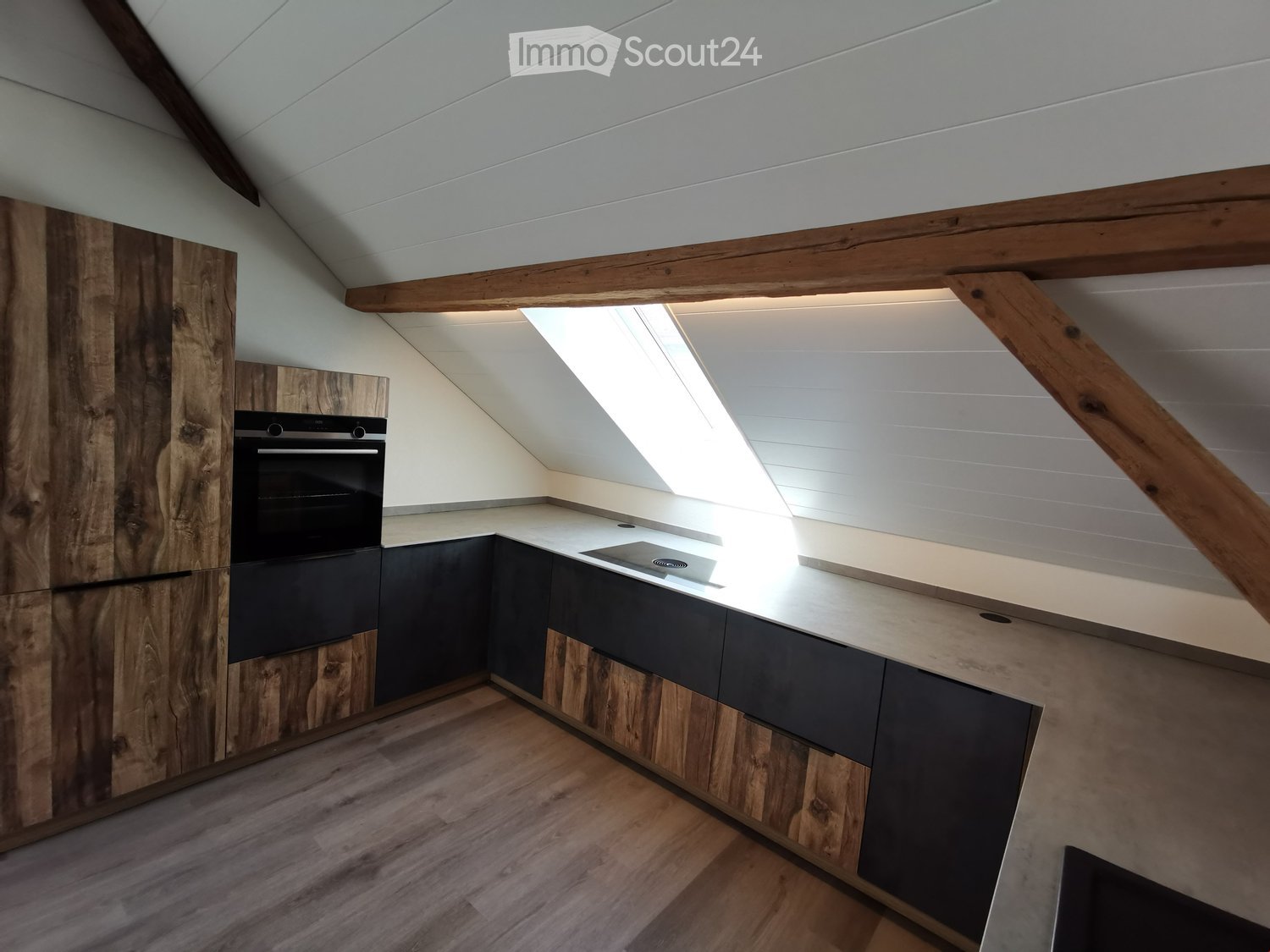 Wooden kitchen cabinets, metal and wood counter, glass top, wooden beams, glass window, wooden floor
