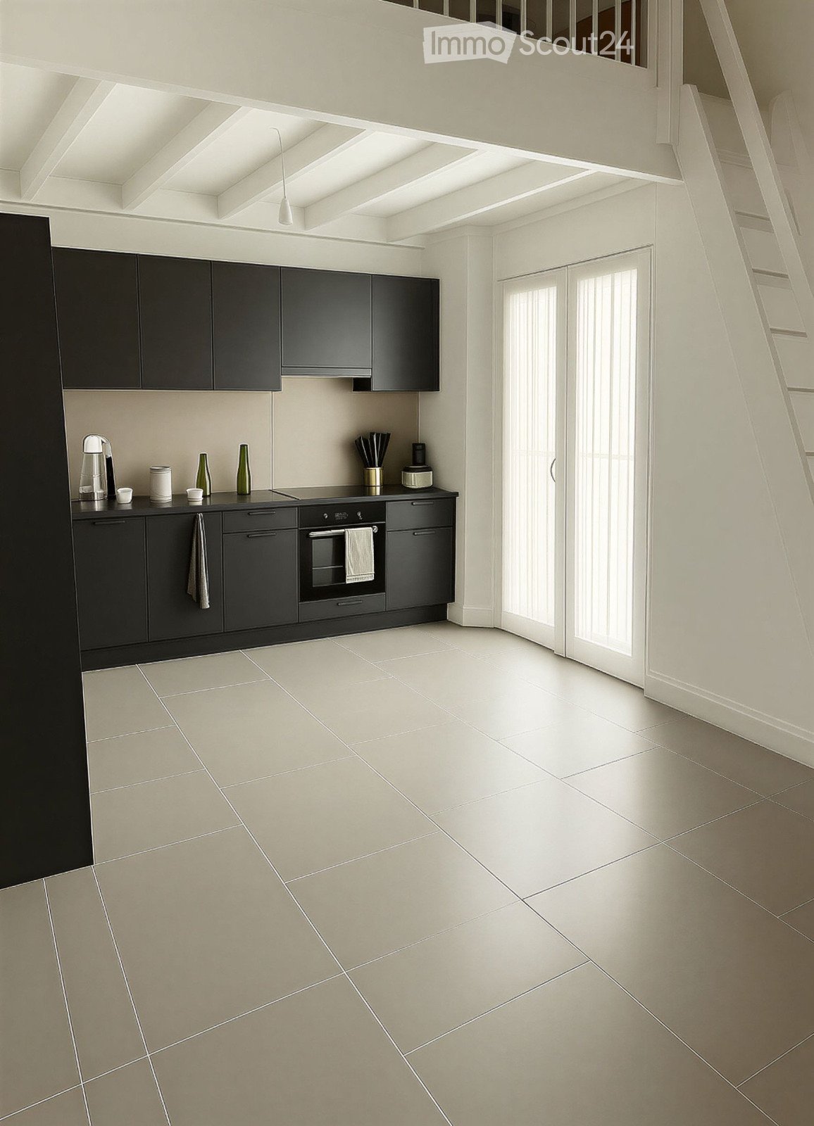 Modern kitchen with black cabinets, white tiled floor, and stainless steel appliances. Features a built-in oven, coffee maker, and various kitchen items on the counter.