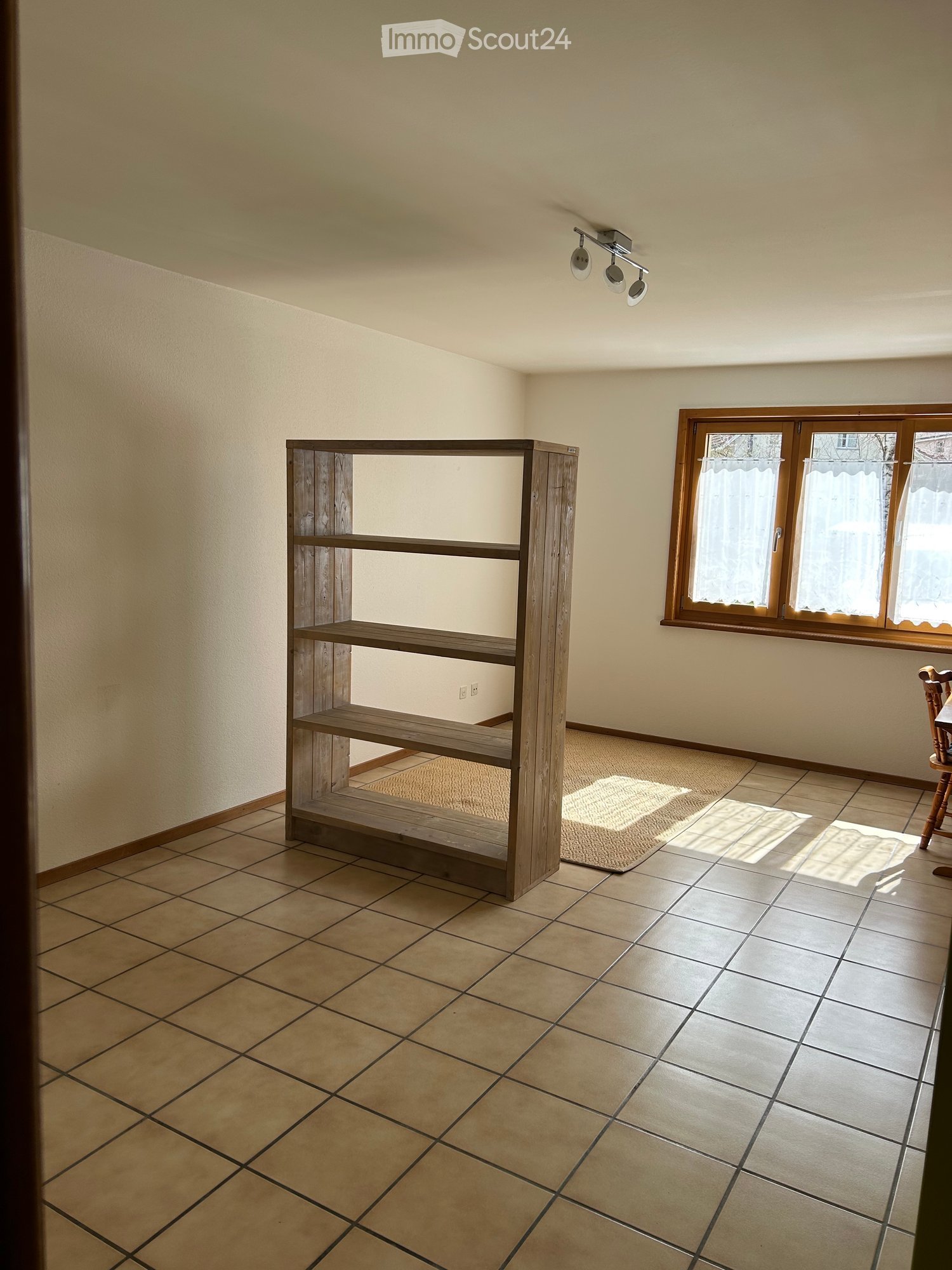 empty room, wooden shelf, beige tiles, white walls, window with curtains, wooden floor