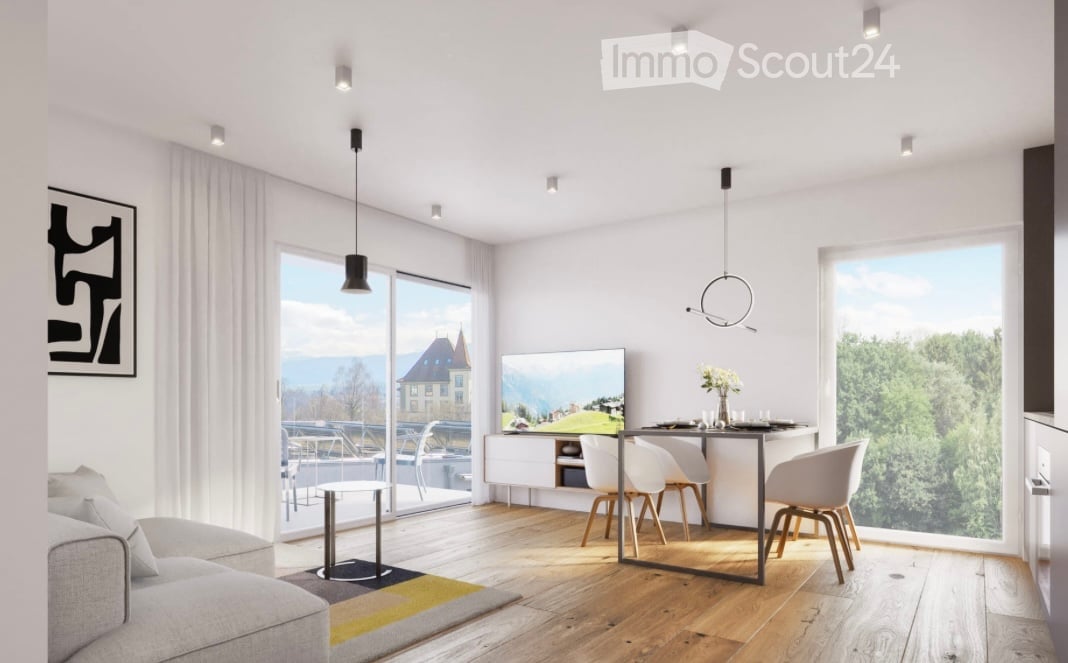 Modern living and dining area with large windows offering a scenic view, featuring a grey sofa, coffee table, dining table with chairs, TV stand, and floor lamp.