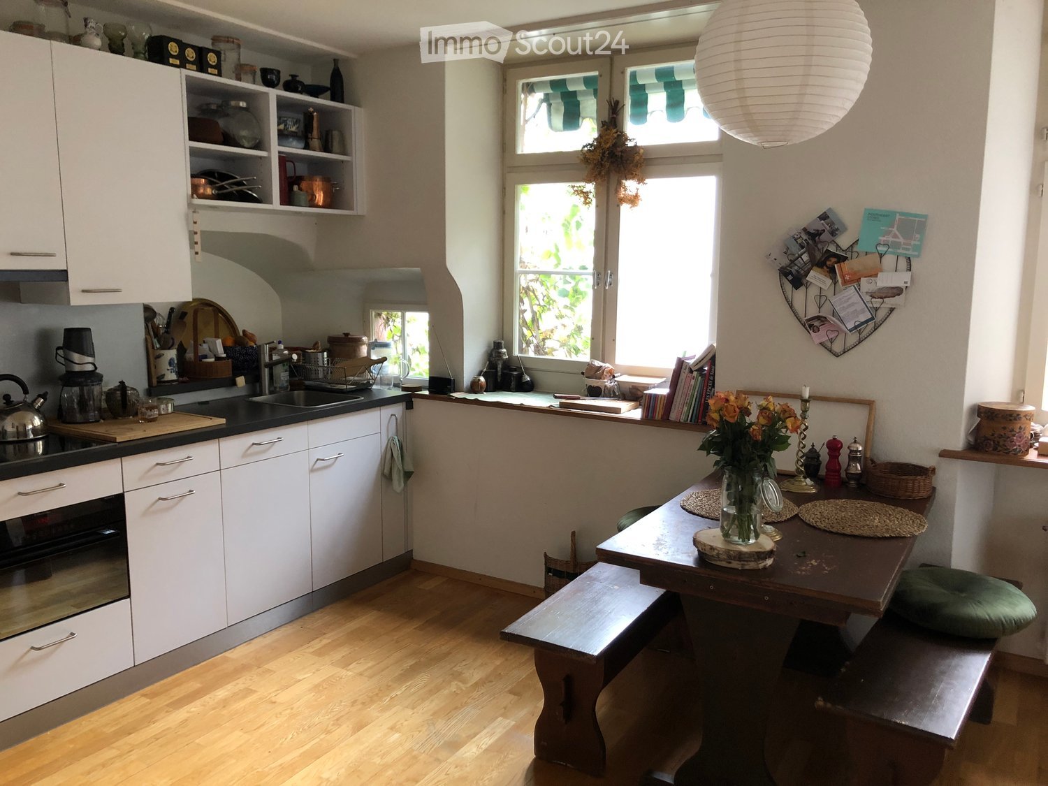 {"type": "Kitchen", "objects": ["cabinet", "oven", "sink", "table", "bench", "vase", "teapot", "blender", "candle", "books", "cutting board", "oven mitts", "kitchen utensils", "bowl", "faucet", "oven", "oven mitts", "oven", "oven", "oven", "oven", "oven",
