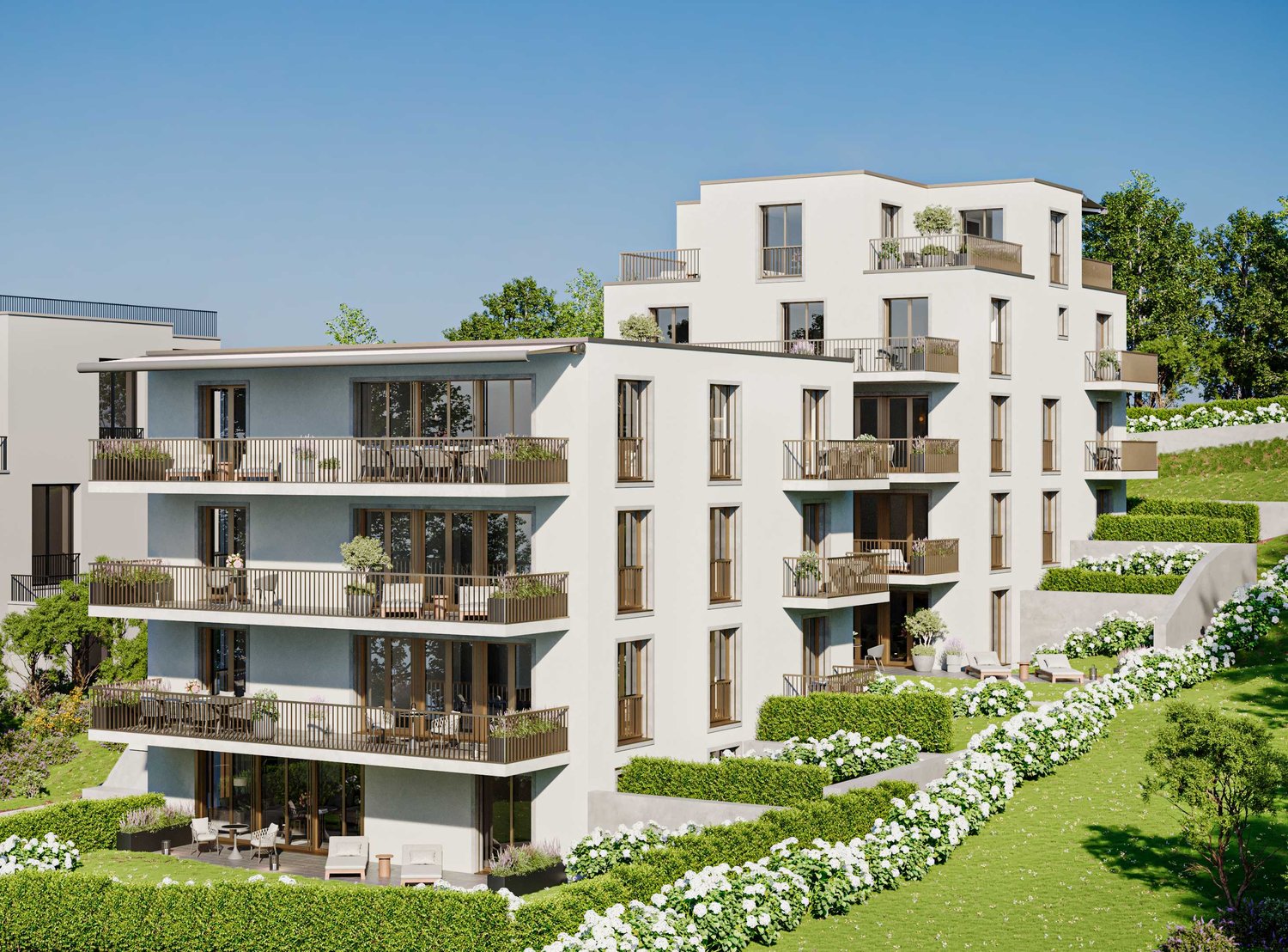 Modern apartment building with multiple balconies, landscaped garden, and green surroundings