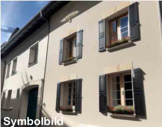 White painted house, black shutters, flower boxes under windows, brown door