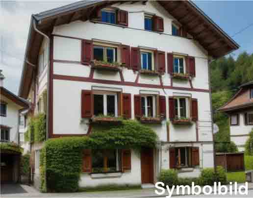 Two-story house, white and brown exterior, red wooden shutters, windows with flower boxes