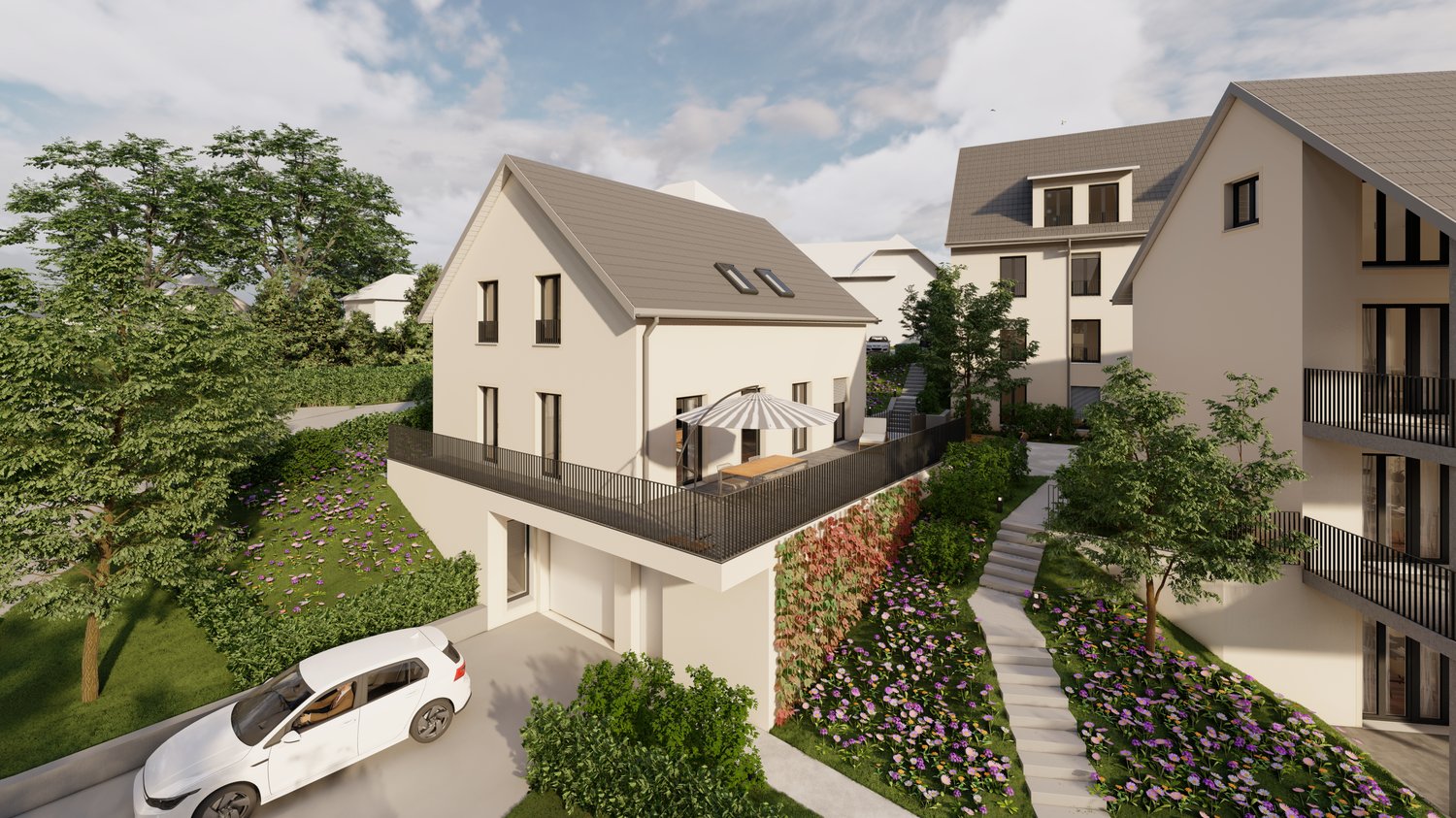 Two-story residential building with a balcony, surrounded by lush greenery and landscaping. The building has a modern, sloped roof design and large windows. There is a parking space in front of the building.