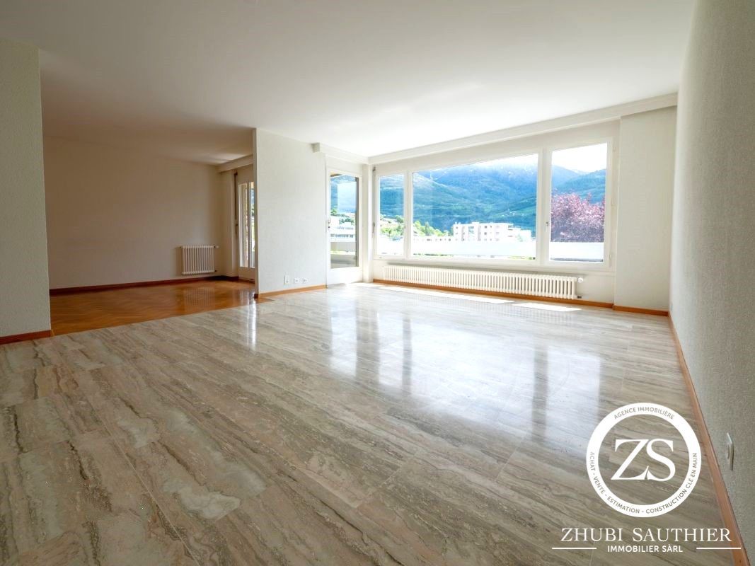 large room with marble flooring, white walls, sliding glass doors, large windows with view, underfloor heating