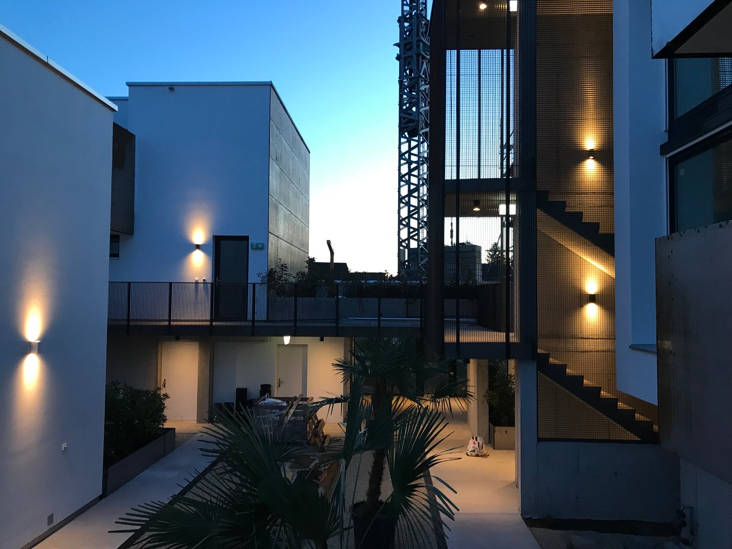 contemporary residential building, white facades, balcony, modern exterior design, ground-floor terrace, architectural elements