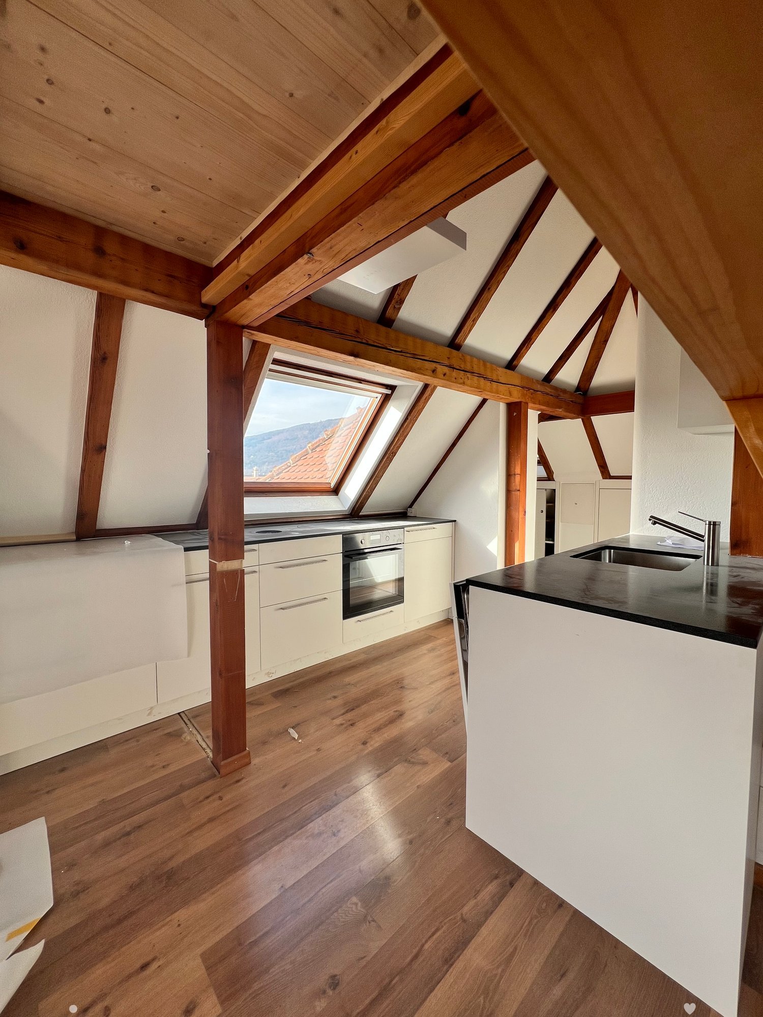 modern kitchen, wooden beams, tiled floor, kitchen appliances, central island, kitchen window