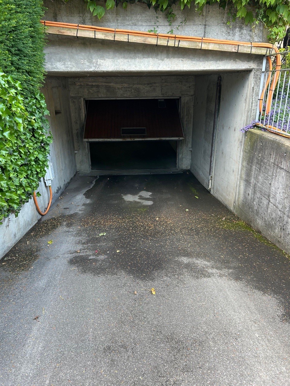 concrete garage, open, paved, gate