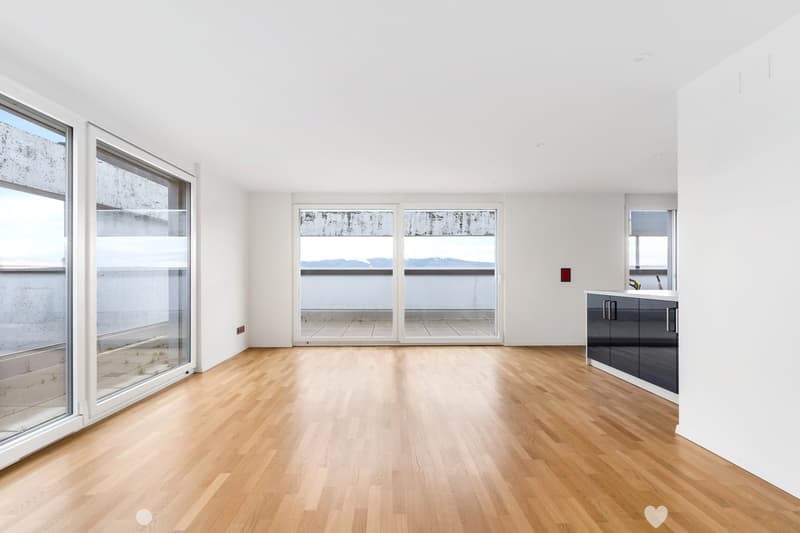 Large windows, balcony, hardwood floors, sliding doors, white walls
