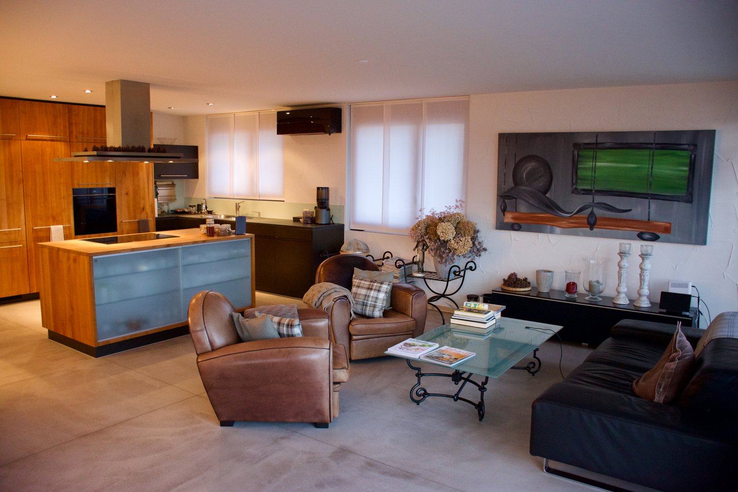 modern living room, leather chairs, glass coffee table, open plan kitchen, island, dark brown leather sofa