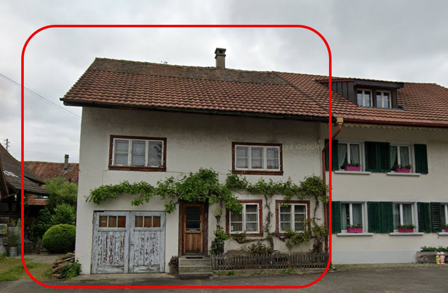 2 story house, tiled roof, white walls, double garage, wooden door, chimney, windows with green shutters, climbing plants