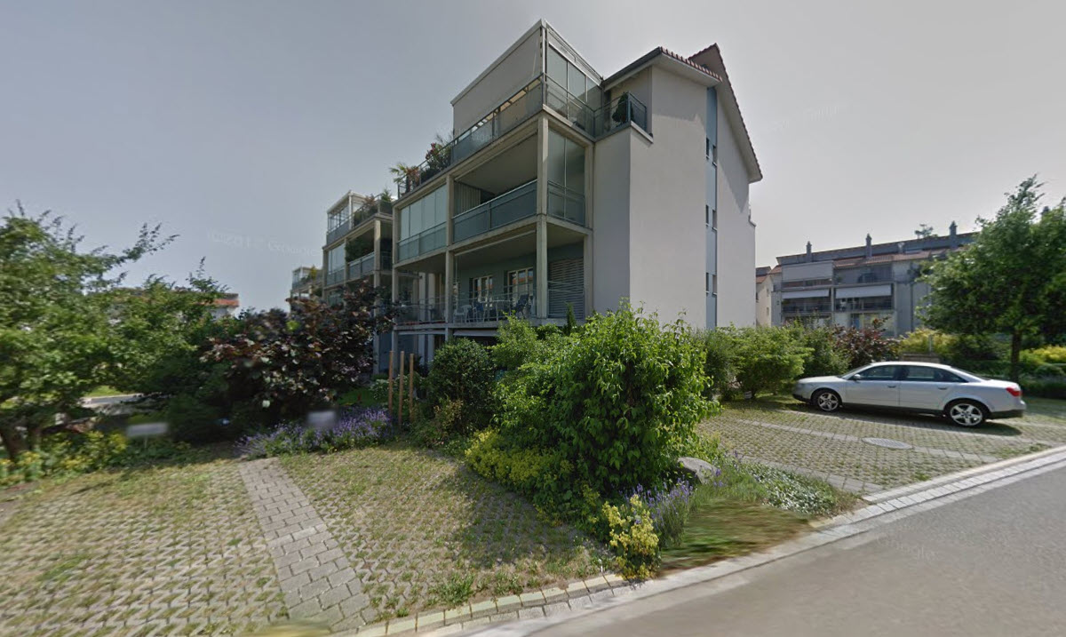 modern design apartment building with balconies and parking space