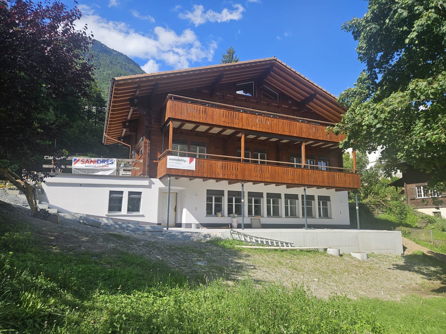 wooden chalet style house, two floors, balcony, mountain view