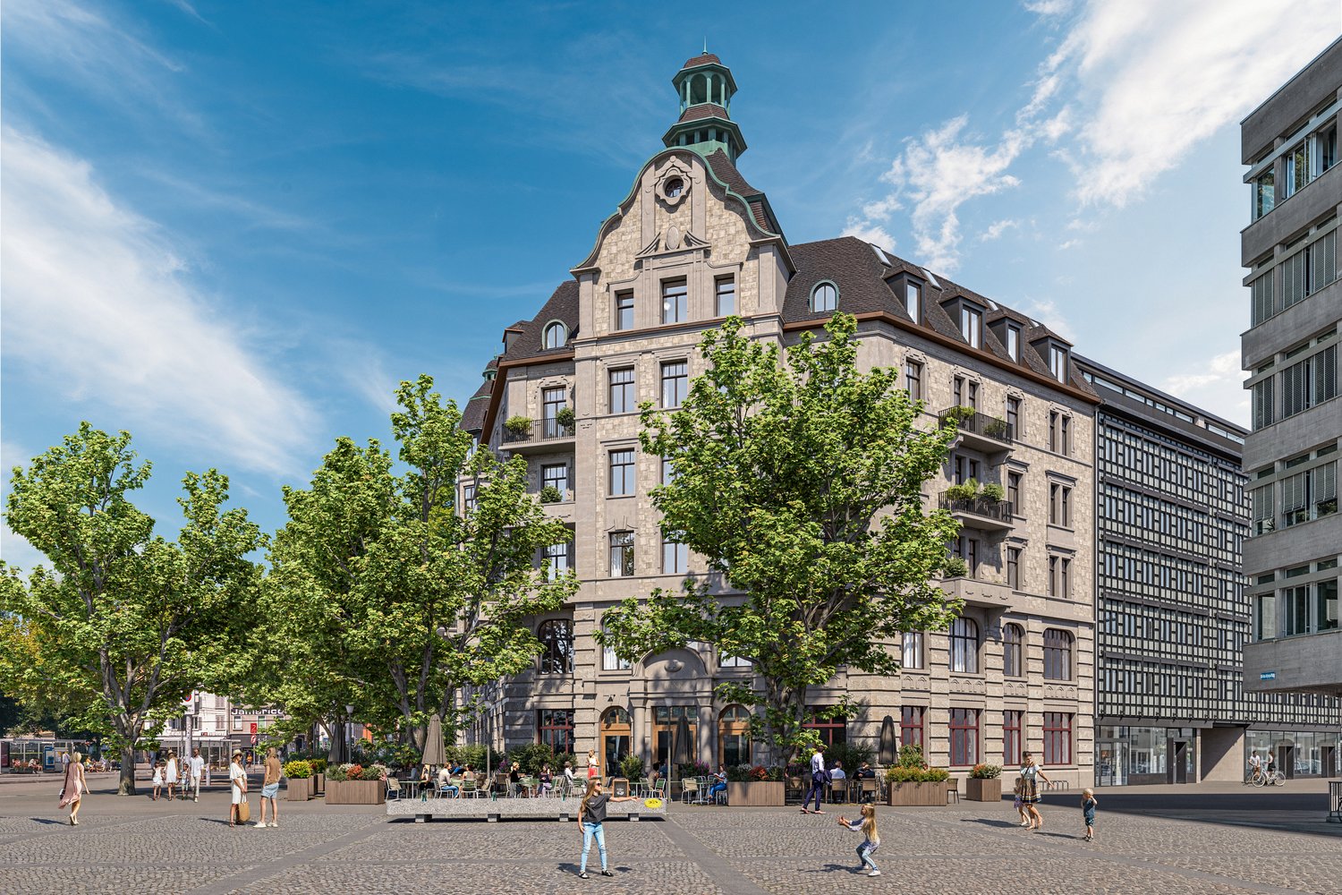 A large, ornate historic building with a distinctive dome-shaped roof and intricate architectural details. The building is surrounded by trees and is situated in a public square with people walking around and enjoying outdoor seating areas.