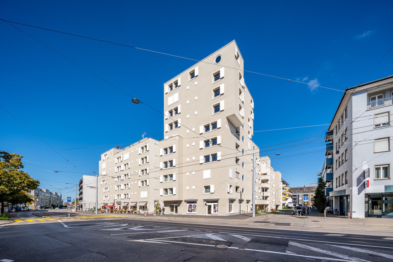 residential building with many windows, several balconies