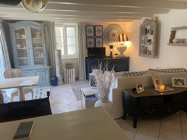 living room, couch, TV, table, chairs, shelves, lamp, decorations