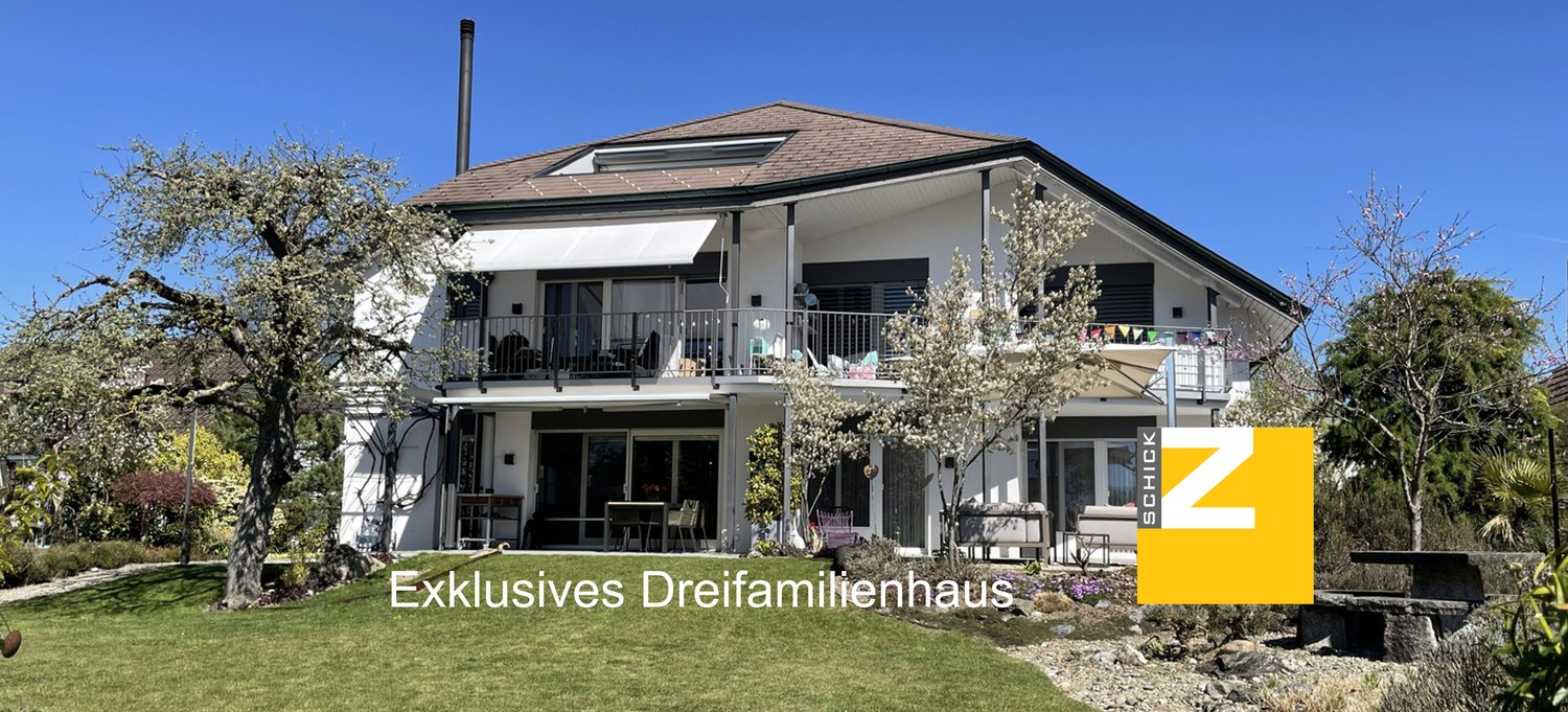 2 story house, white exterior, brown roof, large windows, balcony, garden, trees