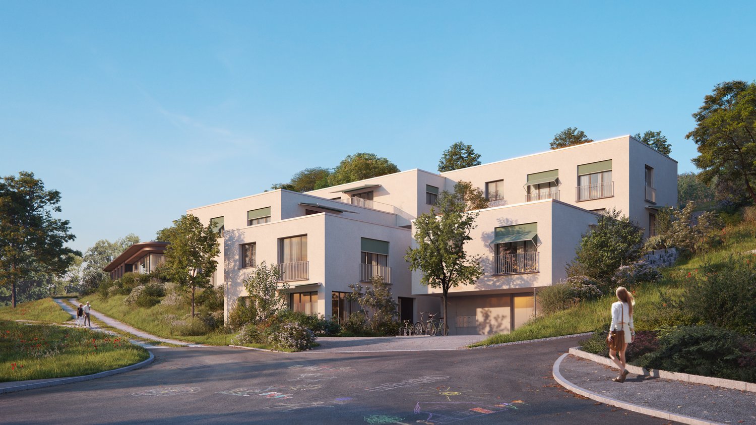 2 story building, cream-colored exterior, multiple balconies, garage, bicycles