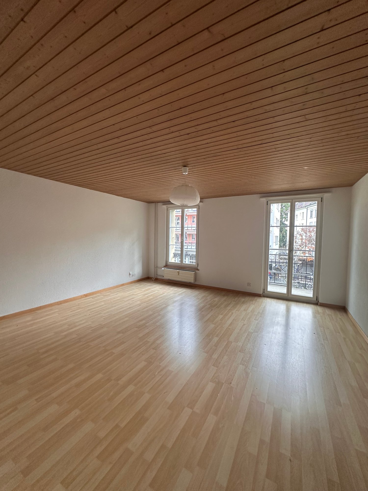 empty room, balcony, windows, wooden floor, wooden ceiling