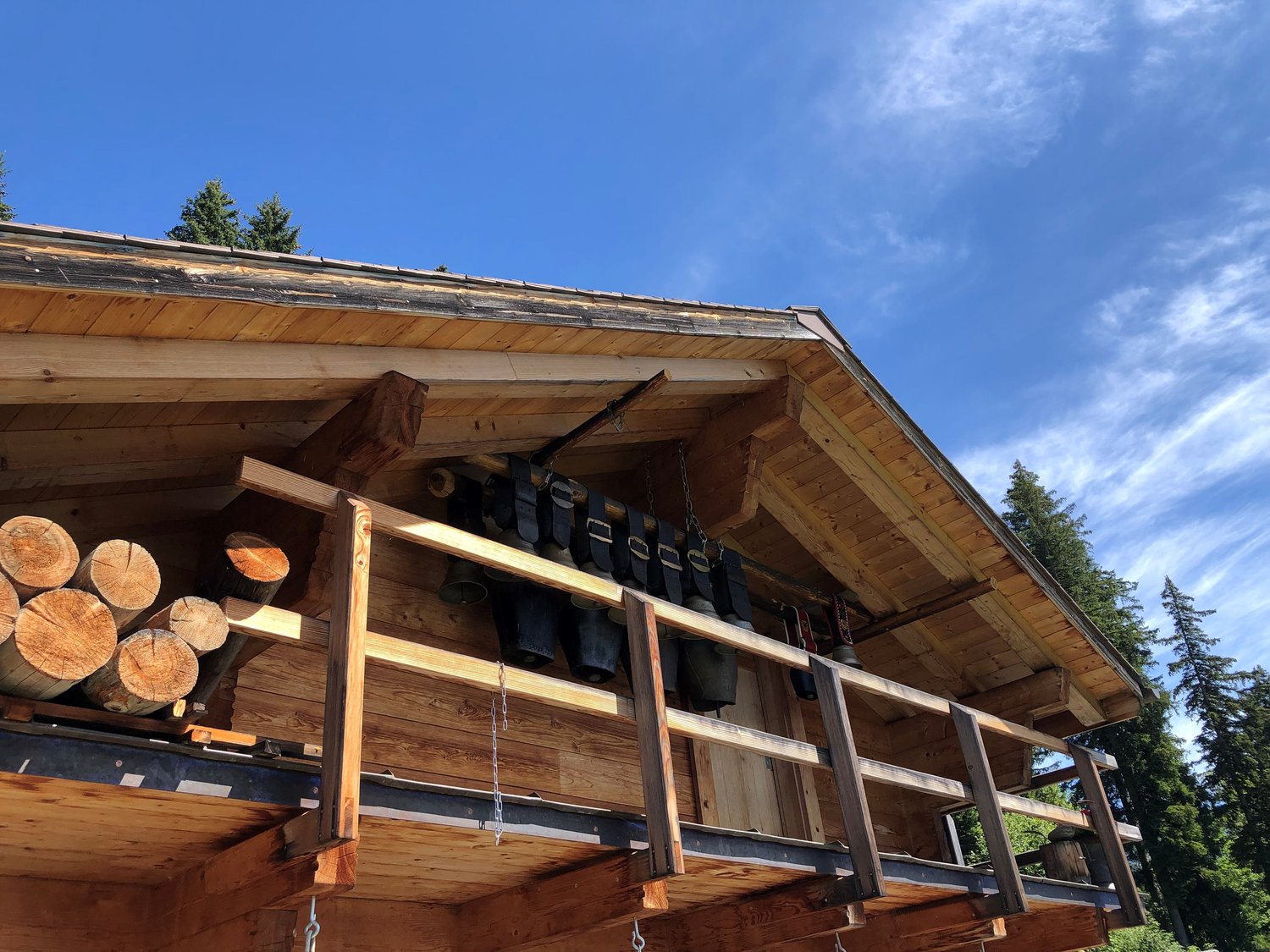 wooden chalet, balcony, wooden roofing, hanging bells