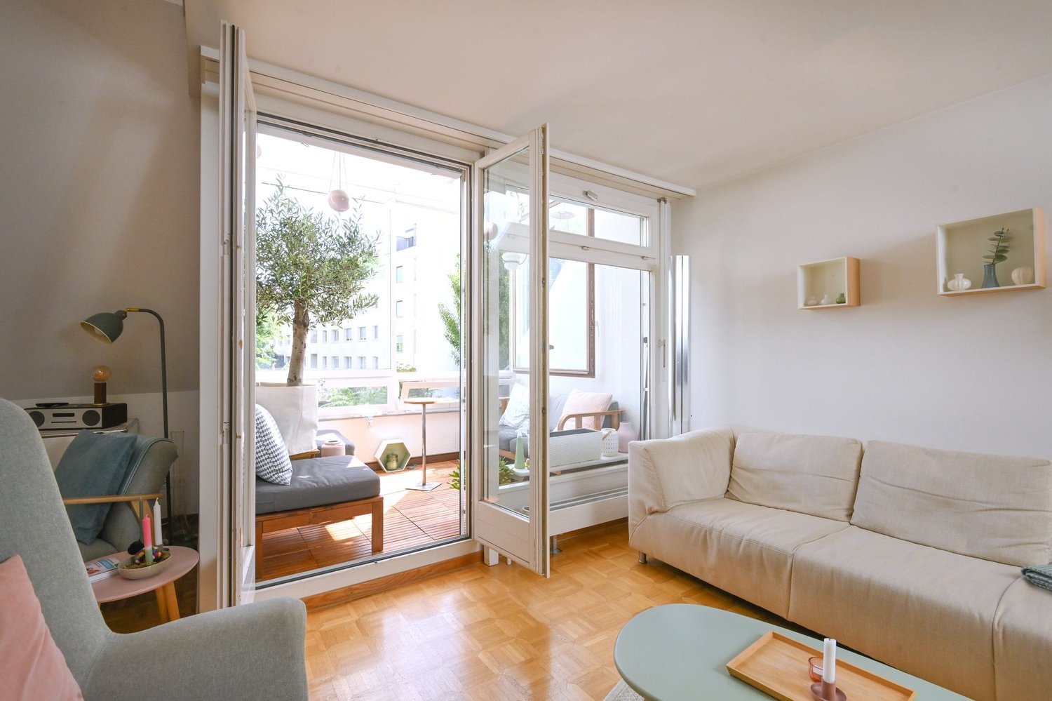 balcony, double bed, couch, wooden floor, sliding door