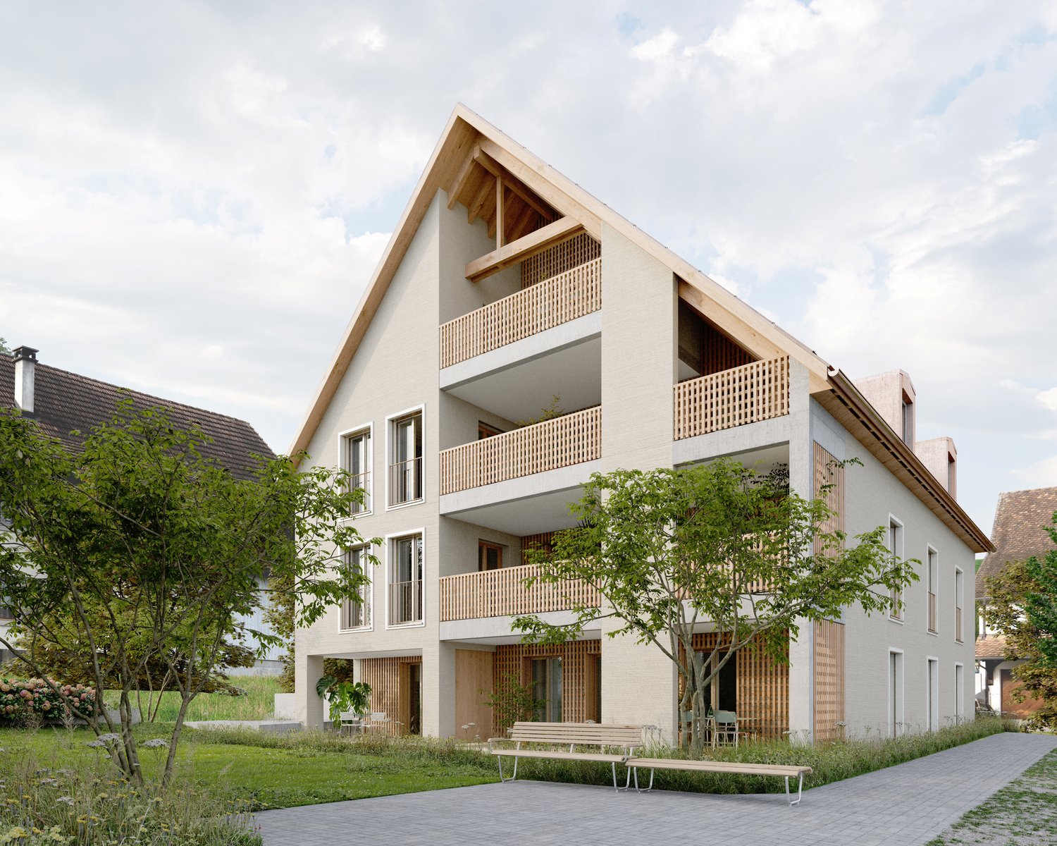 3-story apartment building with a modern, minimalist design. The building features a mix of concrete and wood materials, with large balconies on each floor. The ground floor has an open entrance area with benches. The building is surrounded by greenery an