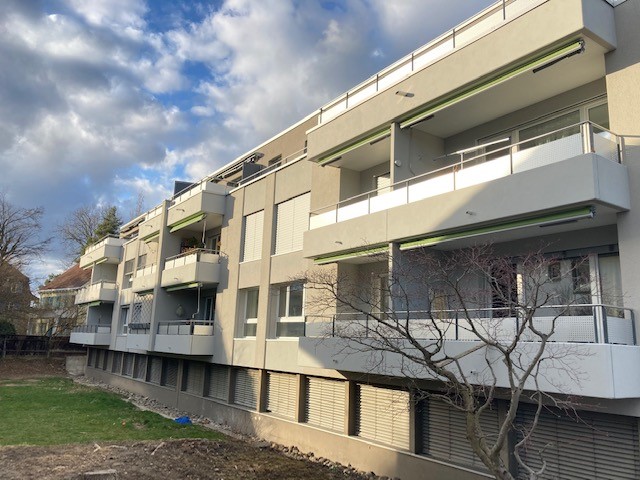 multi-story apartment building with balconies