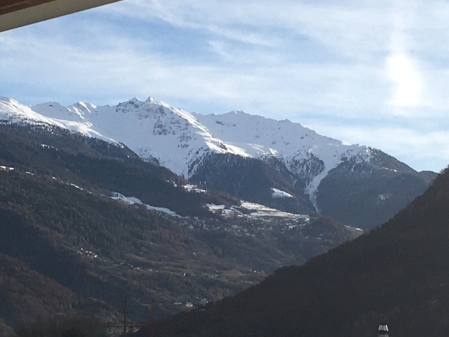 Snowy mountains under a blue sky