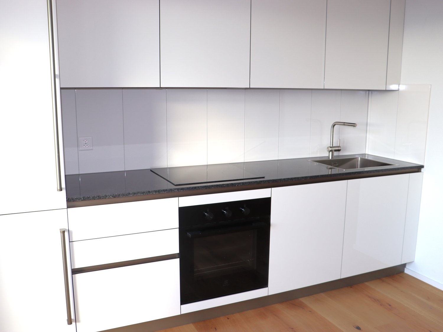 white cabinets, granite countertops, integrated dishwasher, electric stove, oven, stainless steel sink, faucet