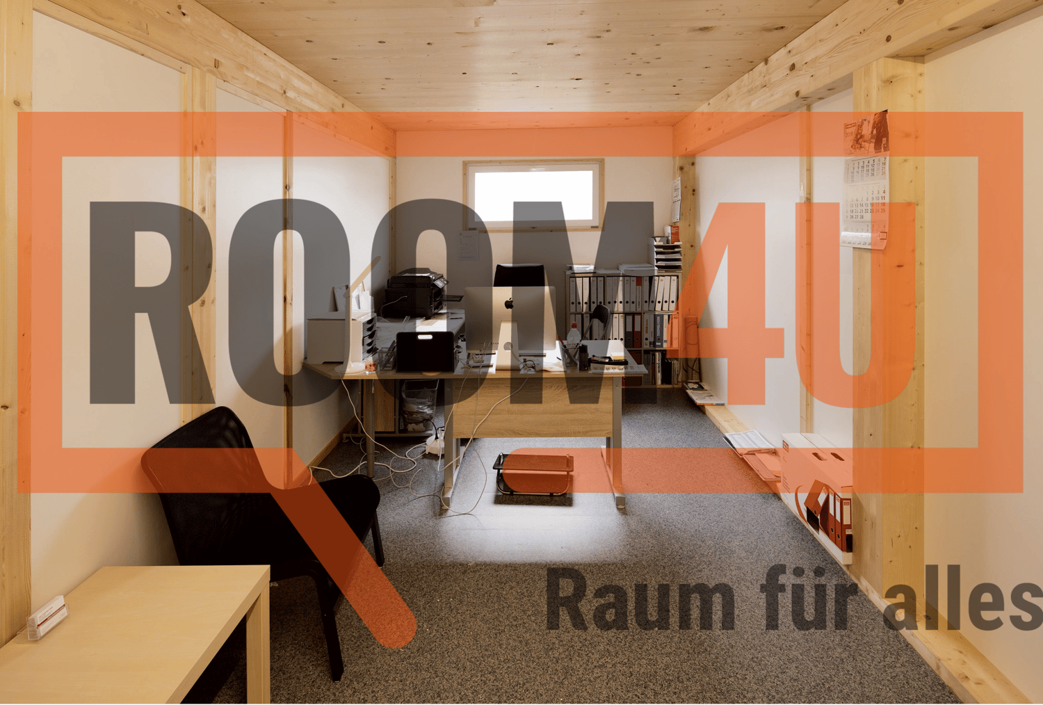 Office room with desk, computer, chair, shelves, and a window
