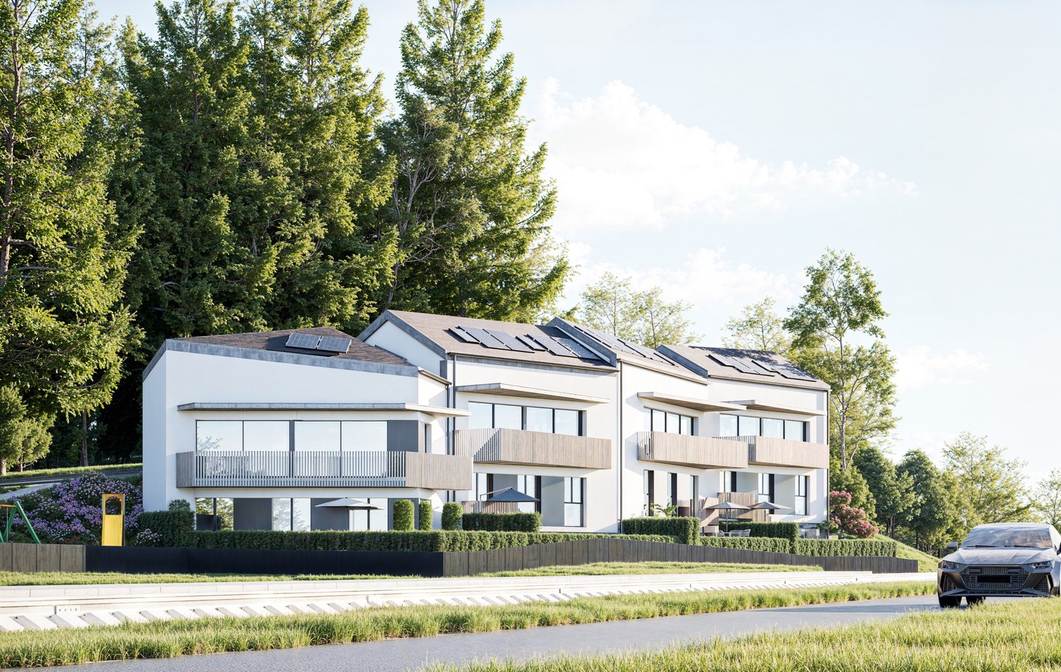 3-story apartment building with white exterior, balconies, and parking spaces in front