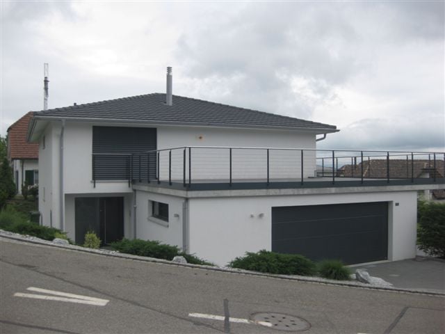 Modern 2 story house, white paint, gray roof, balcony, garage