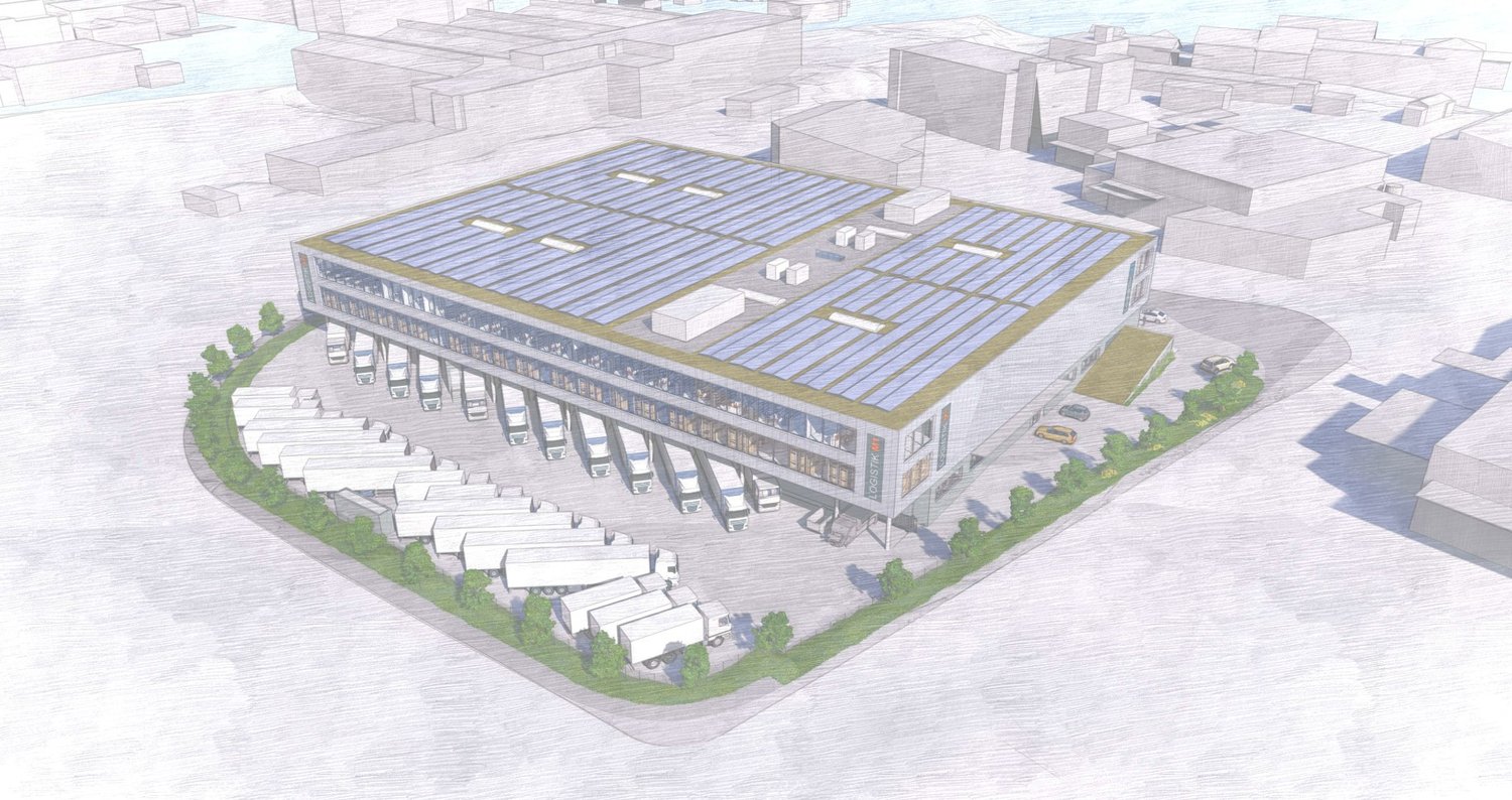 Logistics building with solar panels on the roof, multiple parking spaces for trucks