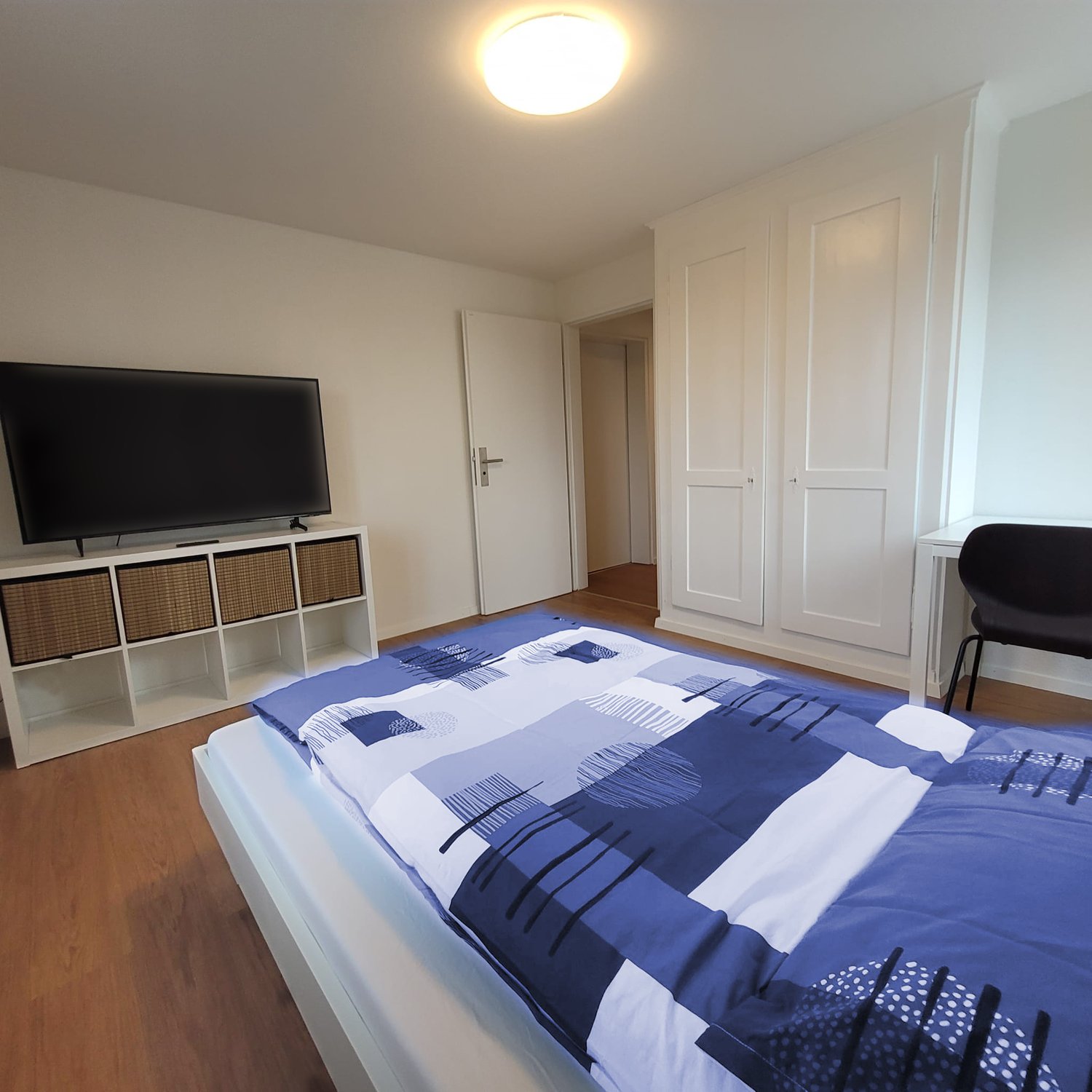 bedroom, bed, TV, wardrobe, desk, chair