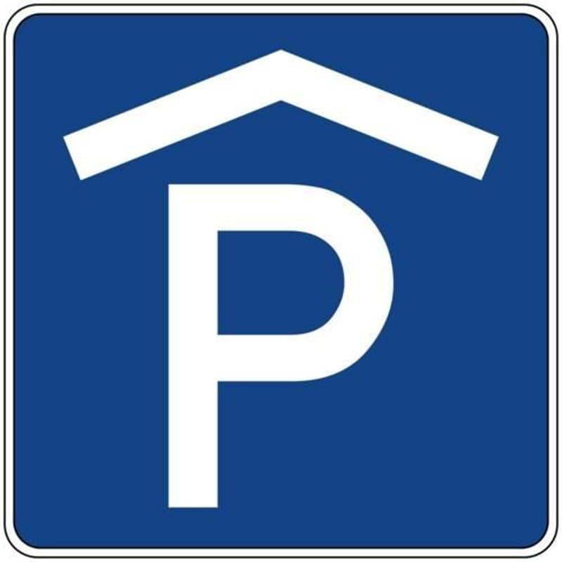Blue sign with white 'P' symbol, indicating a parking area