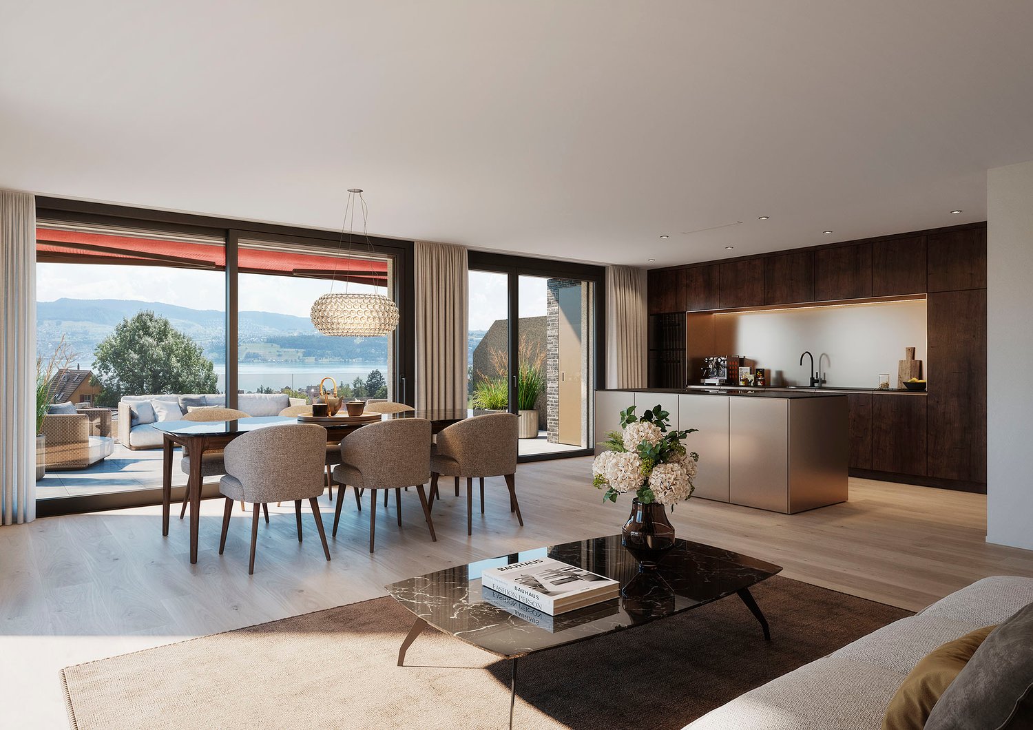 Modern living room with large windows and sliding doors, wooden floor, open-plan kitchen, table and chairs, fireplace, couch, table with flower vase, books, large view of the lake