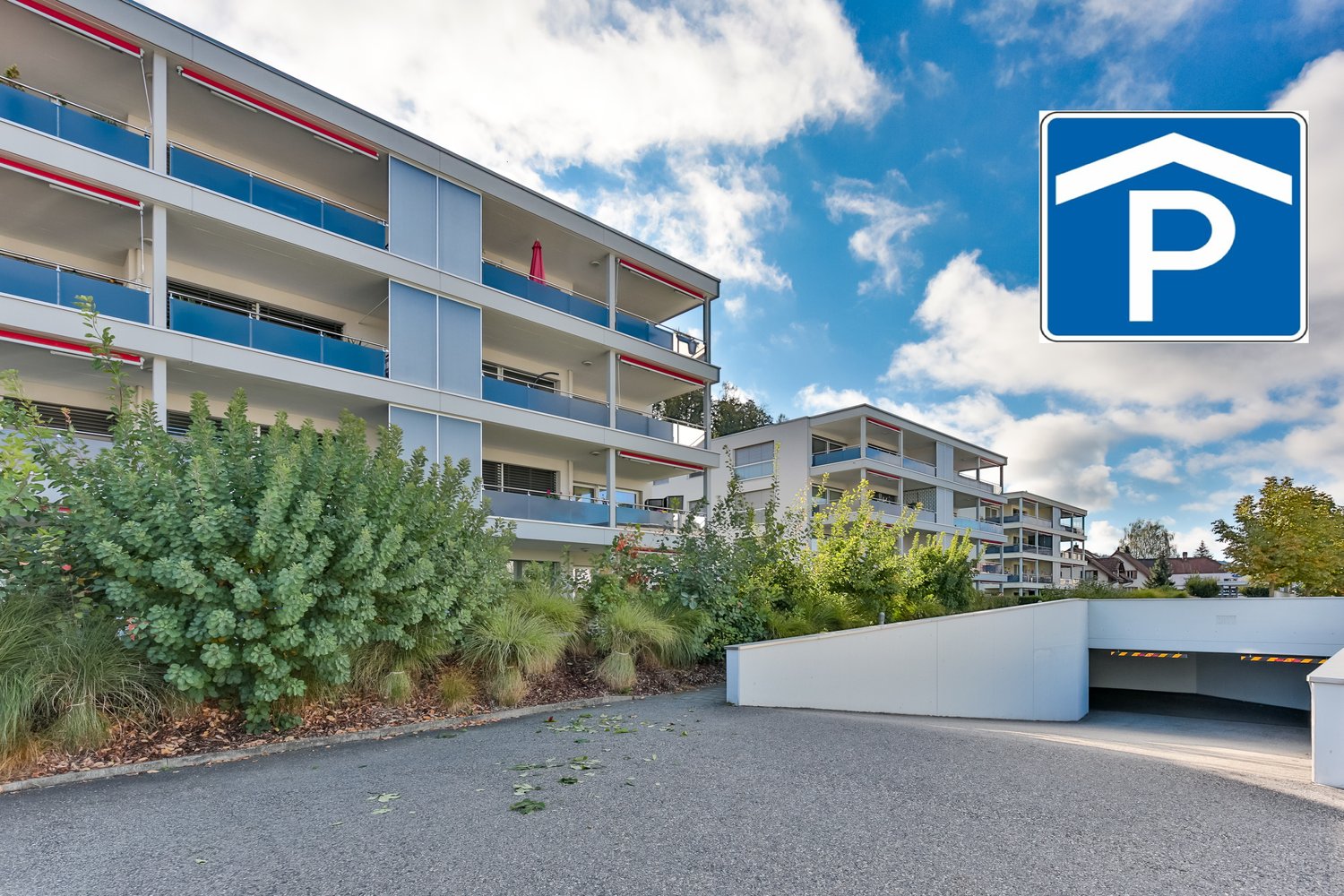 multi-storey building, balconies, underground parking, paved driveway