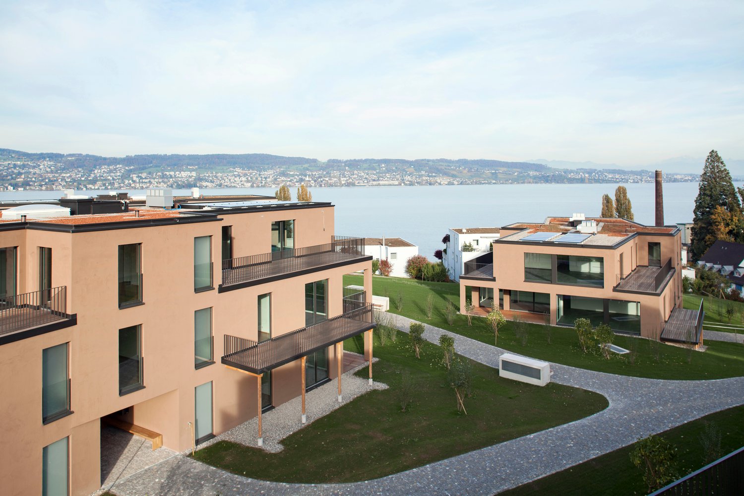 Modern architectural style, balconies, scenic lakeside view, spacious design