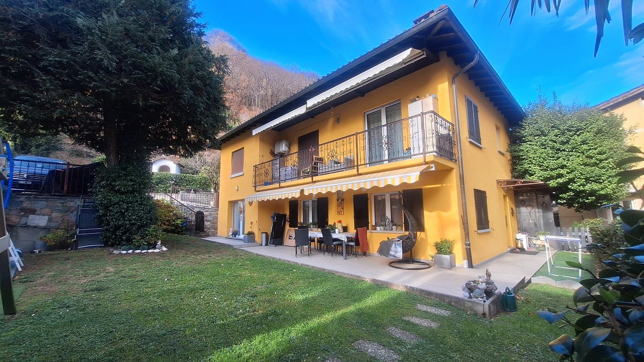 yellow house, 2 stories, balcony, garden, patio