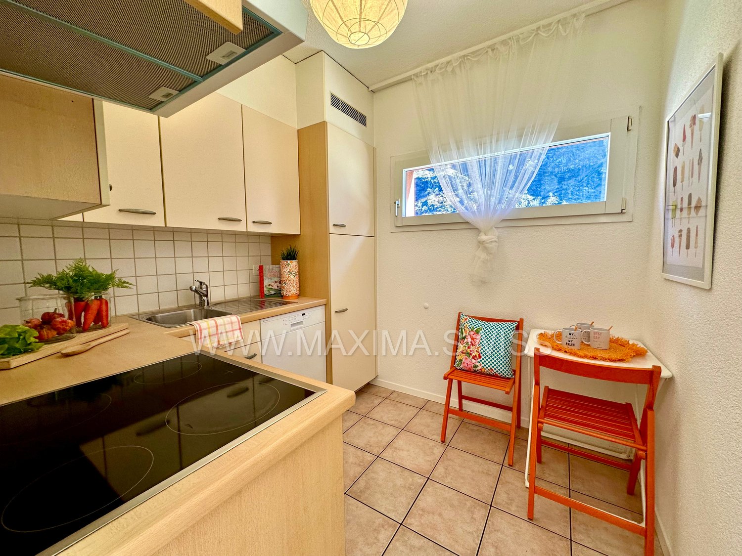 stainless steel sink, gas stove, wooden cabinets, dishwasher, wall mounted power outlets, table with chairs