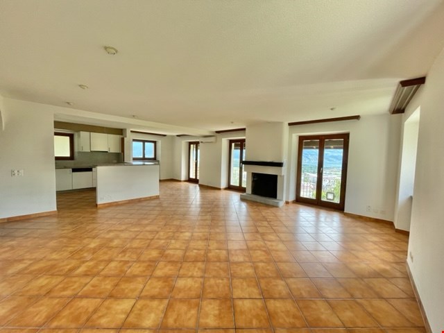 tiled floor, fireplace, sliding doors, windows, kitchen, hallway